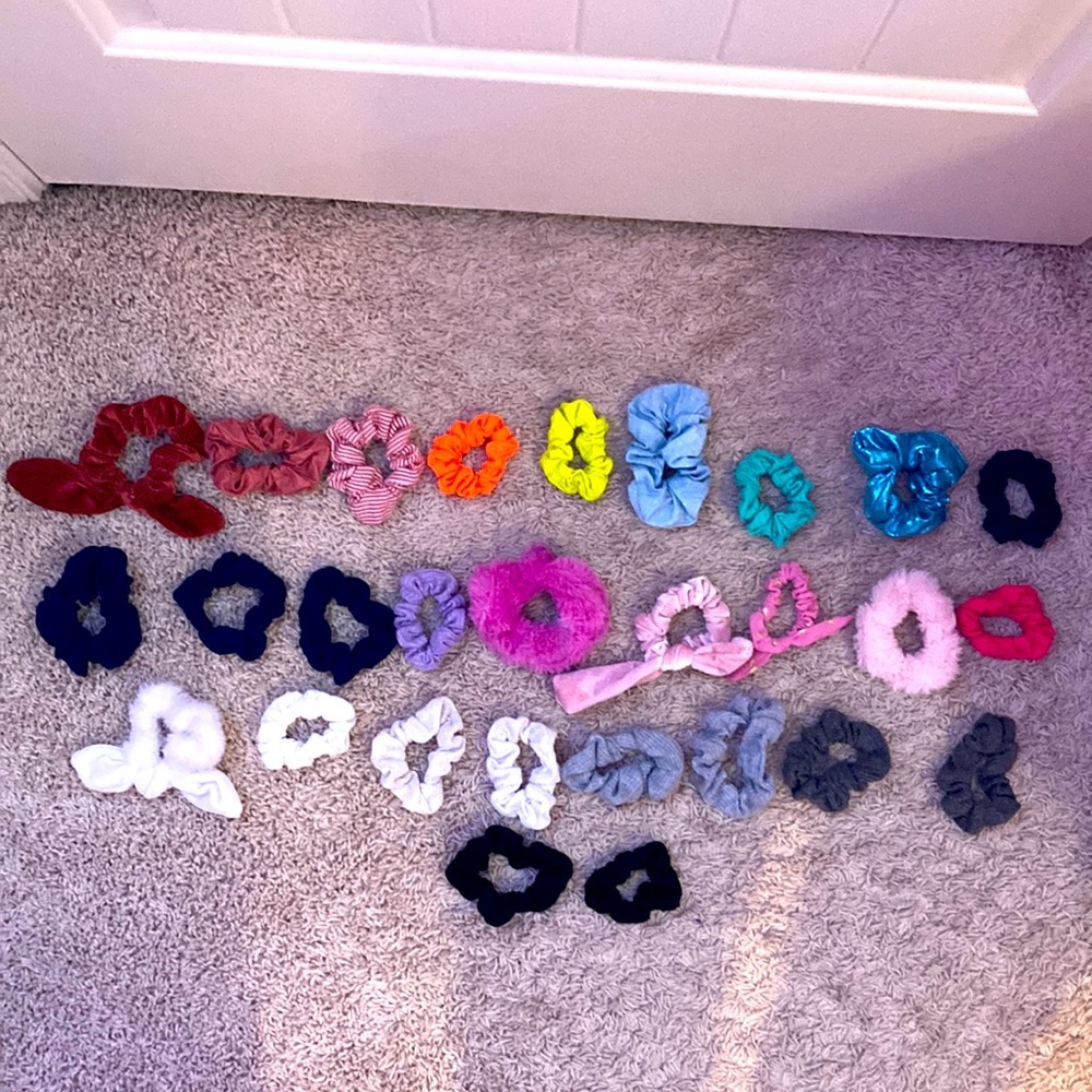 28 scrunches of various colors, textures, and brands